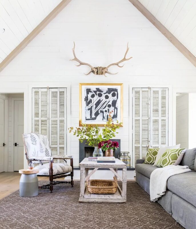 farmhouse-living-room-white-walls-antlers-b6830e3b-2232606-686x800-7207599